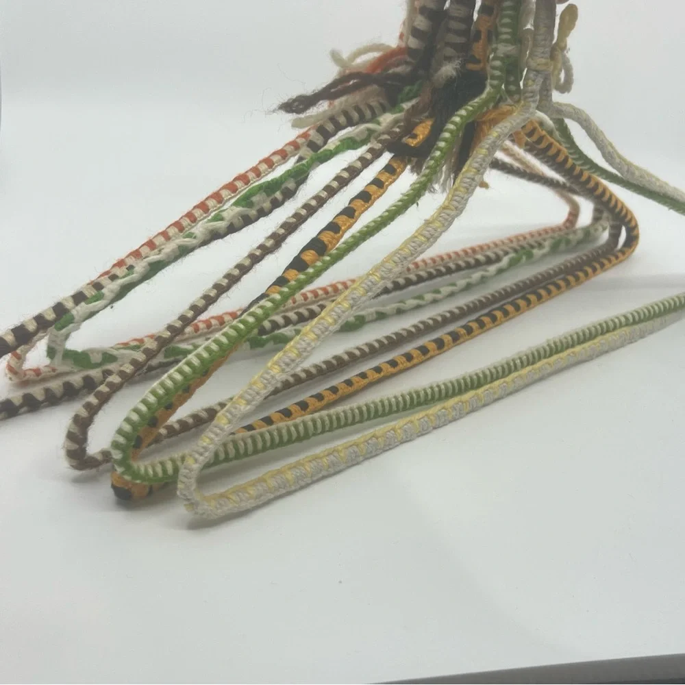 7 vintage wire hangers wrapped in yarn multi color as is